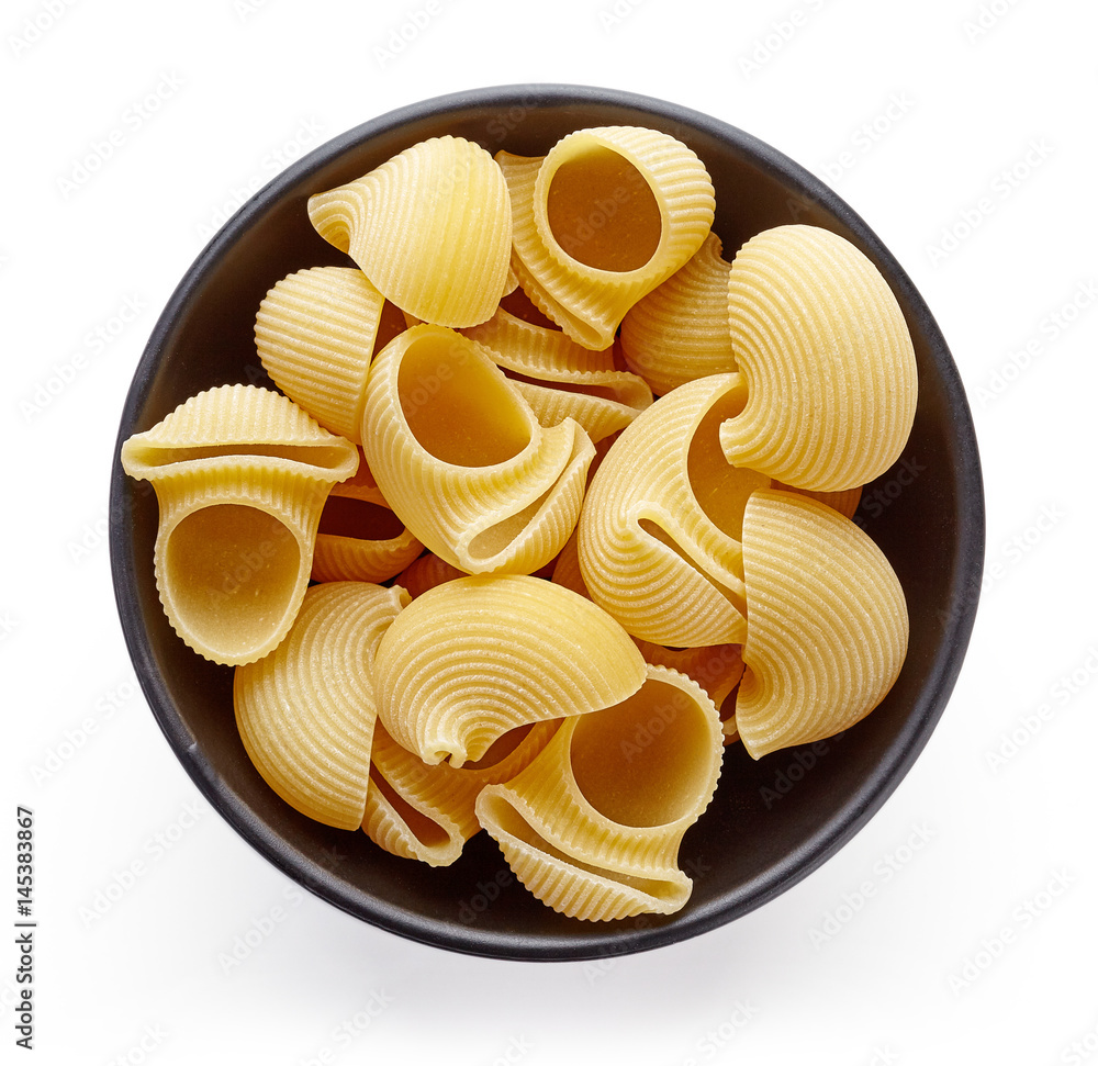 pasta in bowl isolated on white, from above pasta in bowl isolated on white, from above
