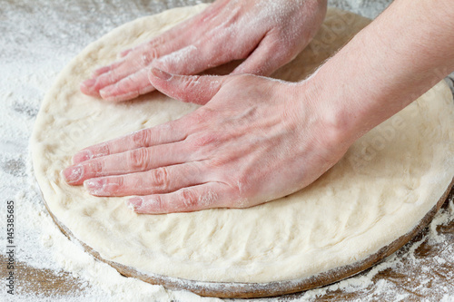 Pizza prepare dough hand topping