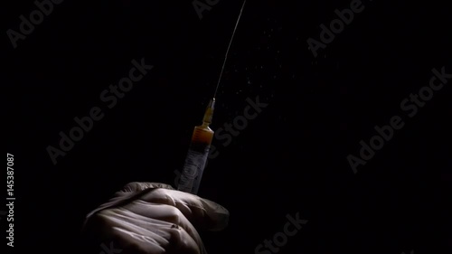 Close-up liquid substance in syringe, drug injection