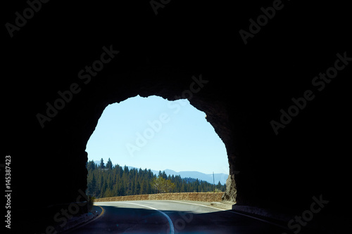 Tunnel with road running through mountains in California