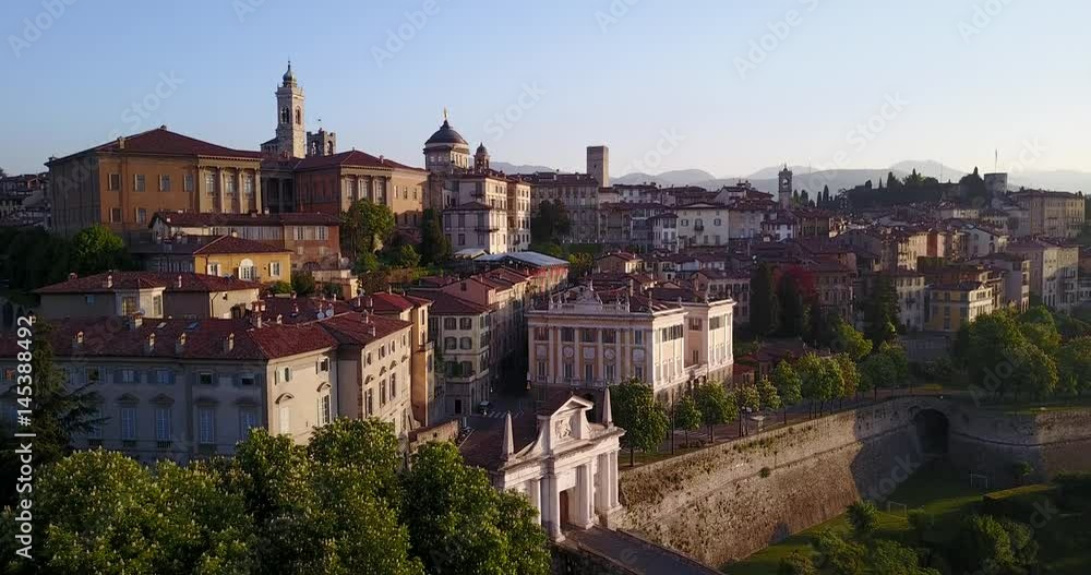 4K Drone aerial view of Bergamo - Old city (Città Alta). One of the beautiful city in Italy. Landscape on the old gate named Porta San Giacomo and historical buildings during a wonderful blu day 4K Drone aerial view of Bergamo - Old city (Città Alta). One of the beautiful city in Italy. Landscape on the old gate named Porta San Giacomo and historical buildings during a wonderful blu day