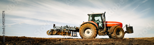 Canvas Print Cultivation of soil for the next grain cultivation, banner - wide format