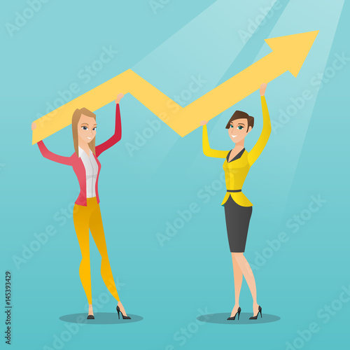 Two business women holding growth graph.