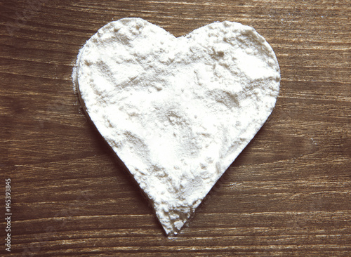 Cocaine in the form of heart, on the table 