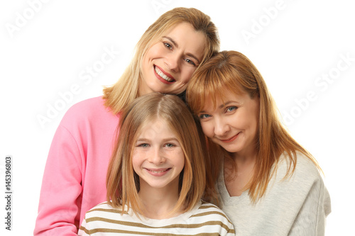 Happy young woman with her mother and daughter on white background