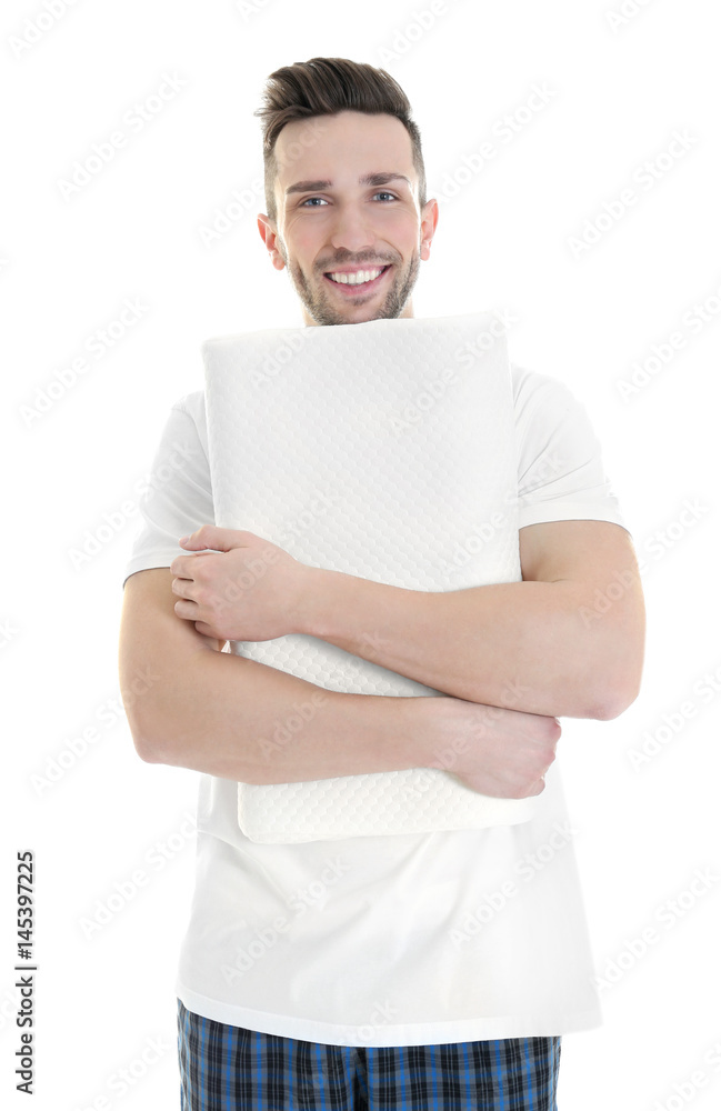 Young man with orthopedic pillow on white background. Healthy posture concept Young man with orthopedic pillow on white background. Healthy posture concept