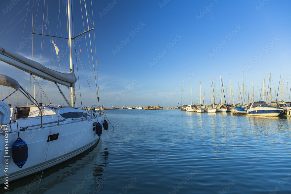 Sailing boats on a calm sea under blue sky Sailing boats on a calm sea under blue sky