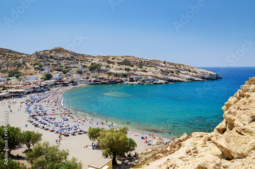 Blue lagoon with sandy beach of Matala town on Crete island, Greece