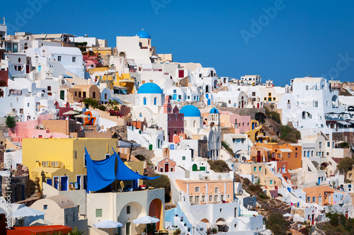 Traditional white architecture with blue churches on Santorini island, Greece
