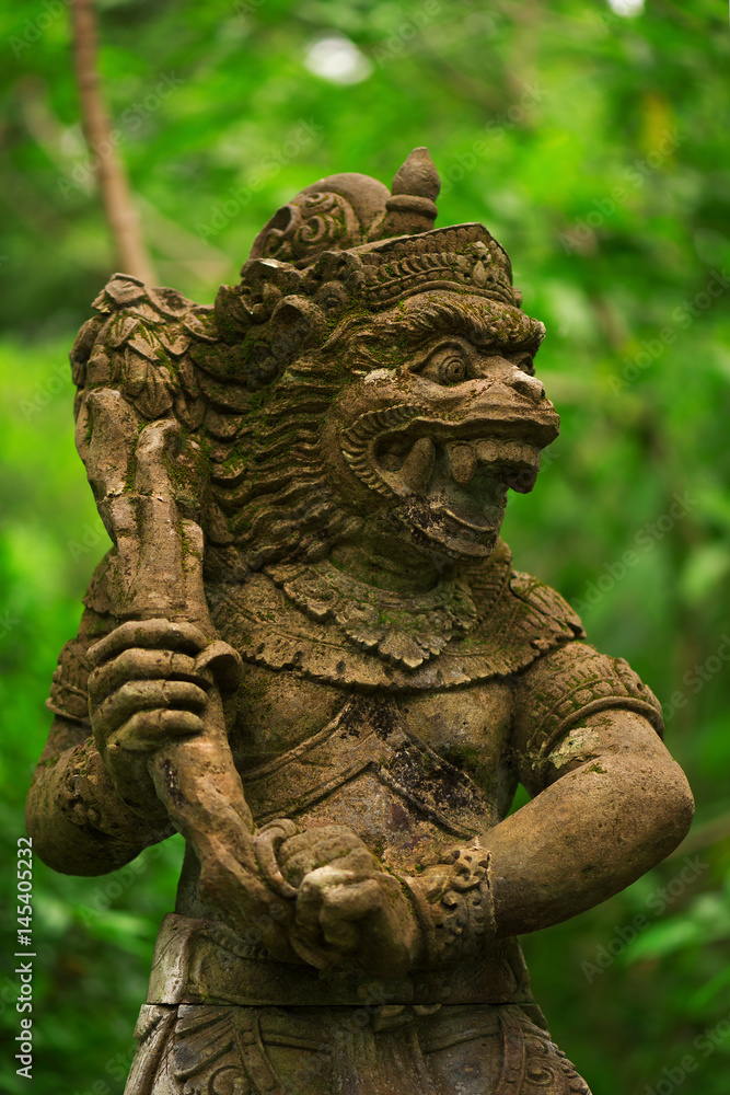 Statues and carvings depicting demons, gods and Balinese mythological deities. God of monkeys. Pura Dalem Agung Padangtegal temple in the Monkey Forest Sanctuary in Ubud, Bali. 