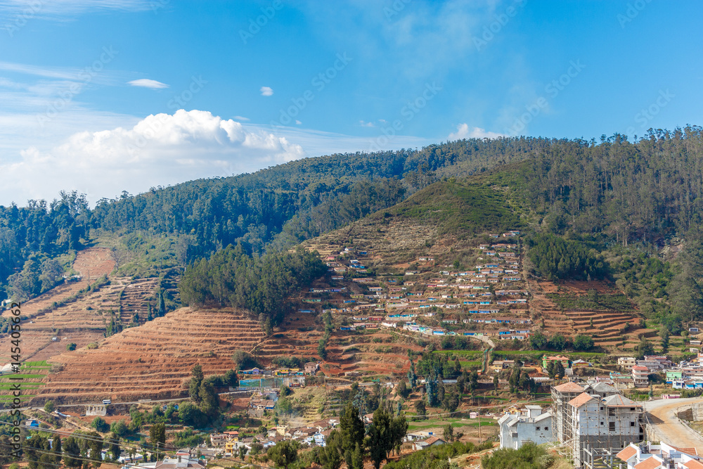 Wide view of houses built on a mountain, Ooty, India, 19 Aug 2016