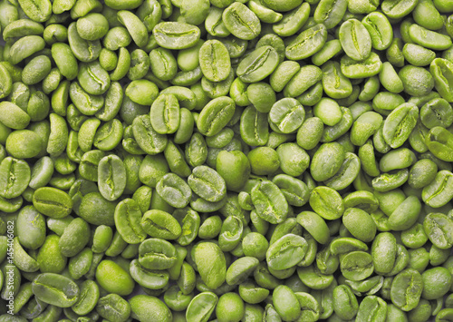 Green coffee beans background.