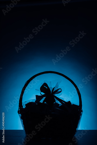 gift basket silhouette on blue background © nikkytok