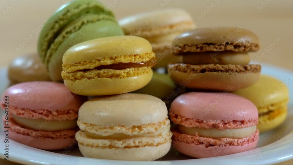 Colorful macarons on plate macro close up Colorful macarons on plate macro close up