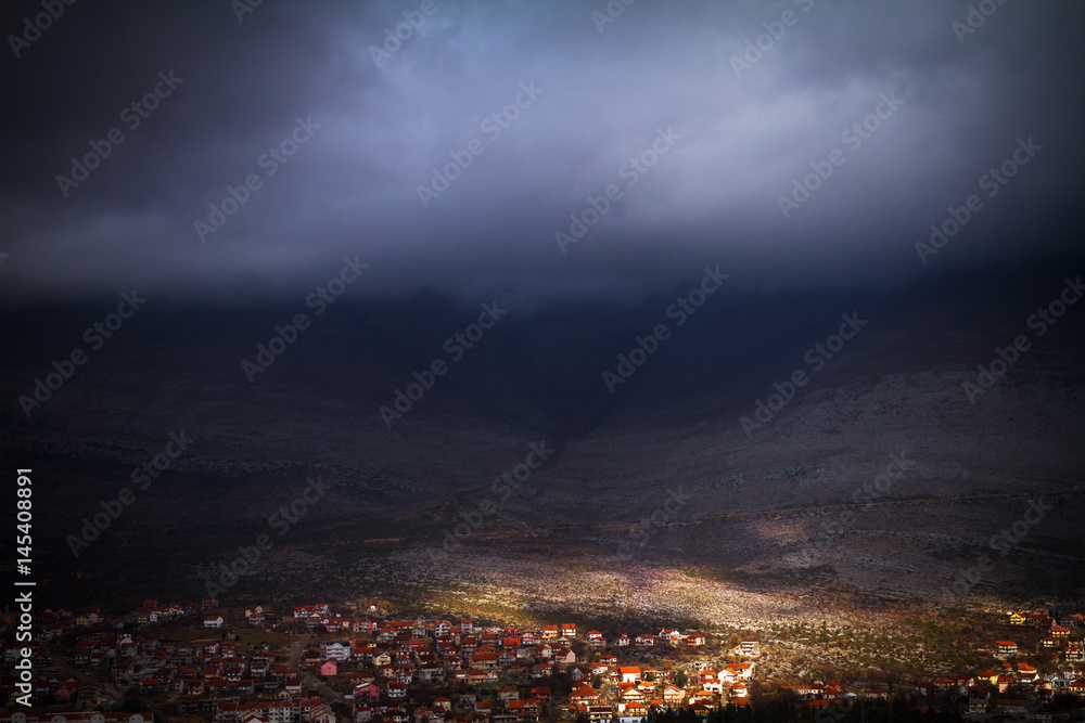 Fototapeta premium TREBINJE-FEBRUARY, 4. Storm cloud over town. Top view to Trebinje city and mountains. February, 4, 2017, Trebinje, Bosnia and Herzegovina.