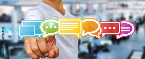 Photos Businessman using colorful flat conversation icons 3D rendering