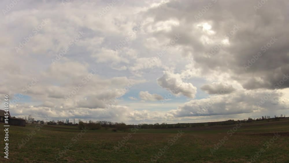 Time-lapse. Field against the sky with clouds in the spring Time-lapse. Field against the sky with clouds in the spring