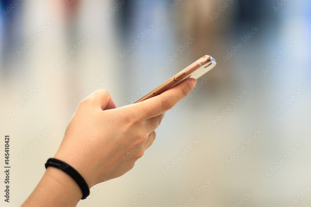 Cell phone and Woman's hand Cell phone and Woman's hand
