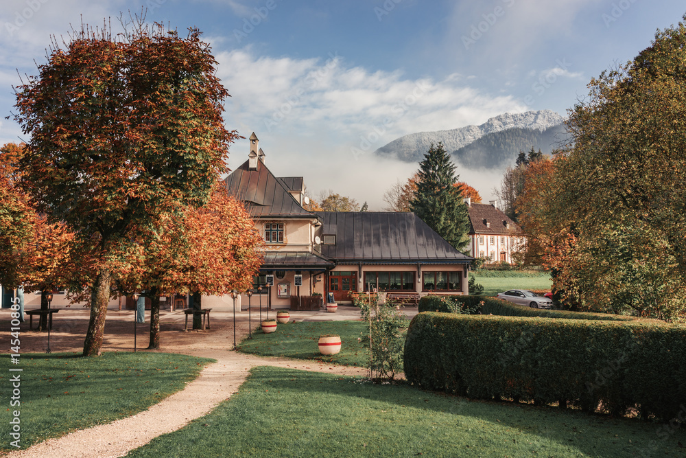 Koenigssee, Germany. Exhibition building as a contribute Romy Scheider, a famous actress, with the mountains around the Koenigssee in the background