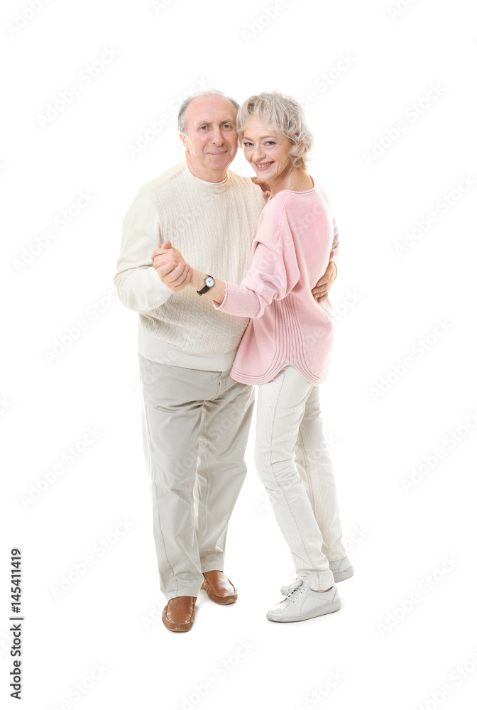 Happy senior couple dancing on white background Happy senior couple dancing on white background