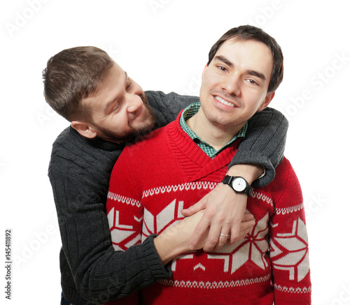 Happy gay couple posing on ...