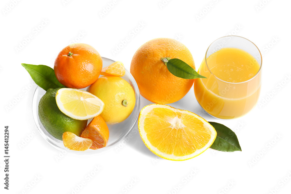 Glass of fresh juice and bowl with citrus fruits on white background Glass of fresh juice and bowl with citrus fruits on white background