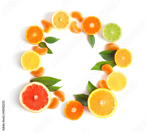 Frame of juicy citrus fruits on white background
