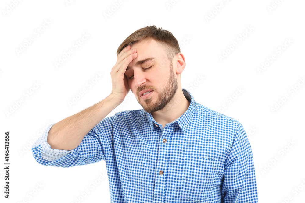 Young man suffering from headache on white background Young man suffering from headache on white background
