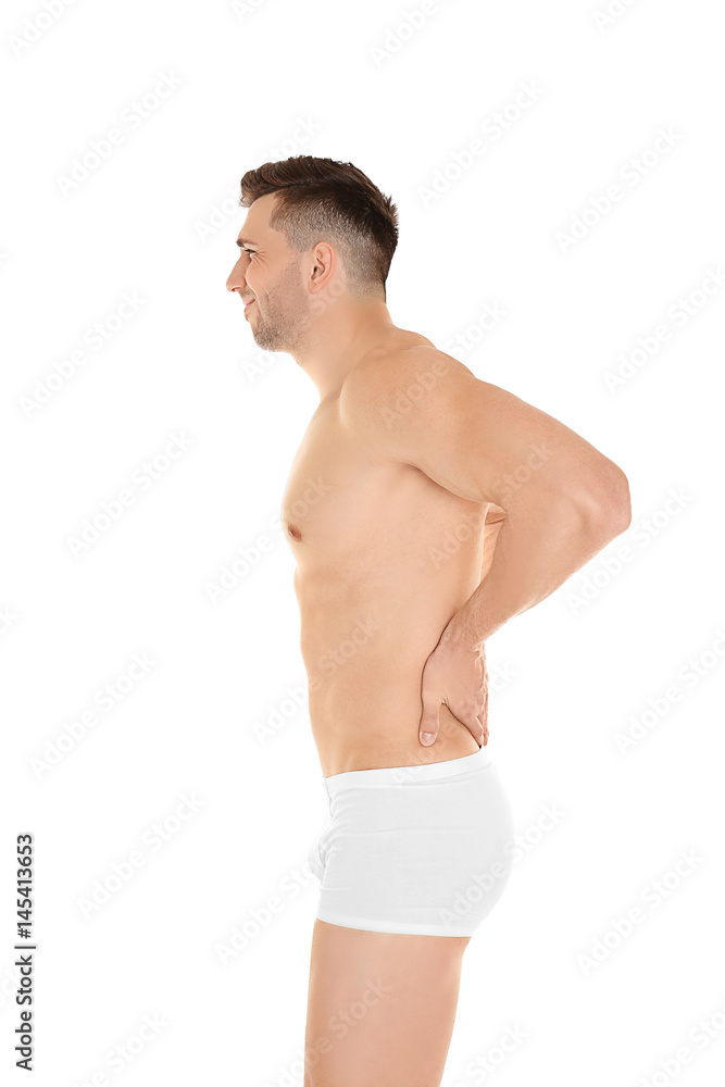 Young man suffering from back pain on white background Young man suffering from back pain on white background