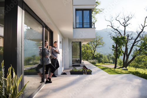 couple enjoying on the door of their luxury home villa © .shock