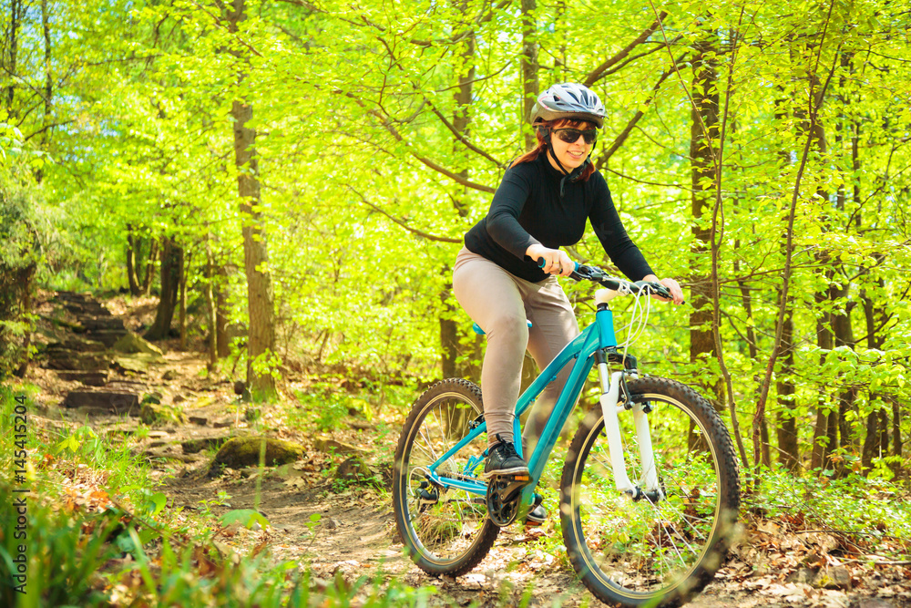 Fototapeta premium Young Woman Riding Her Mountain Bike