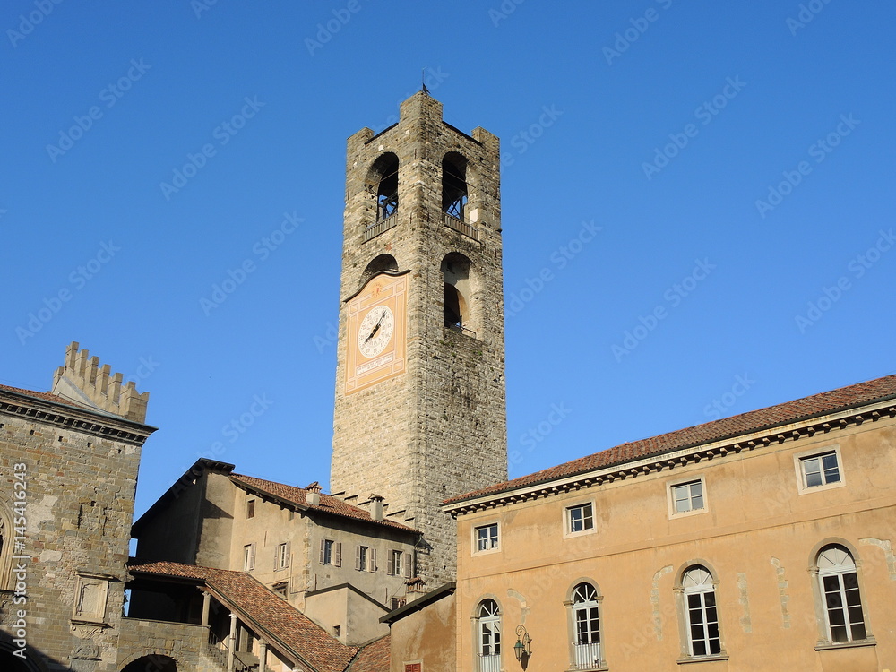 Bergamo - Old city (Città Alta). Landscape on the the ancient Administration Headquarter called Palazzo della Ragione and the clock tower called Il Campanone