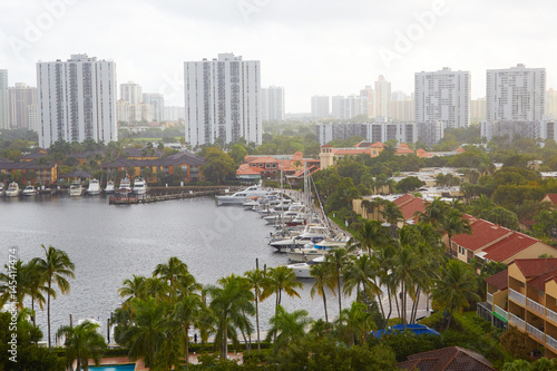 Scenic view of harbor with high rises and leisure ships
