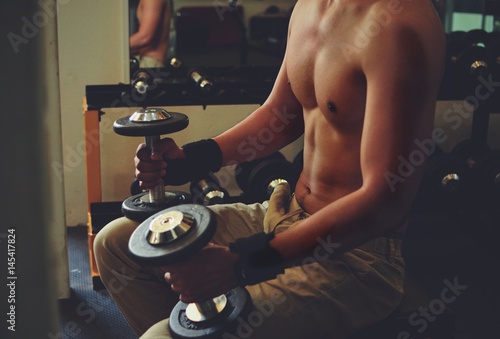 sportman with weight training  photo