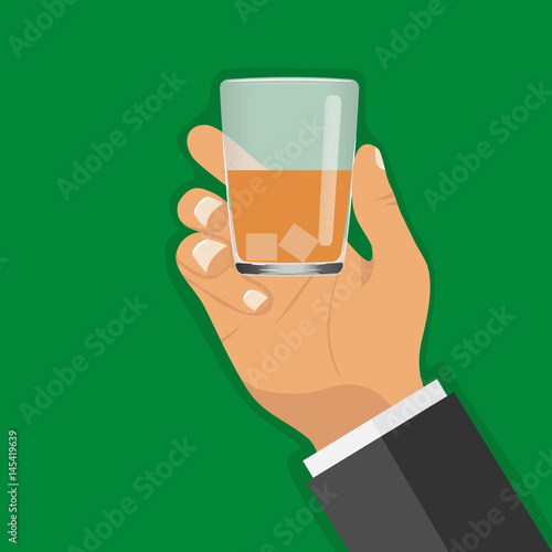 A glass with a drink in his hand photo