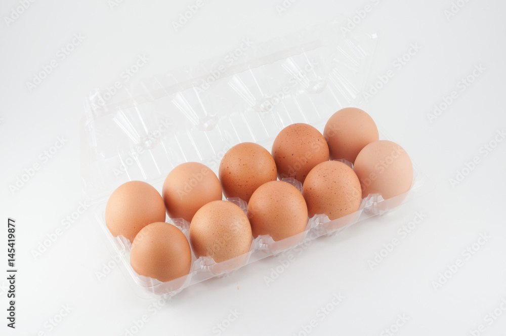 eggs in plastic box on white background eggs in plastic box on white background