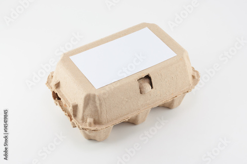 Paper egg box - egg carton on white background
