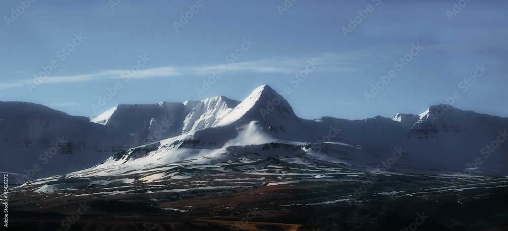 Fototapeta premium Mountains with snow in spring, east of Iceland
