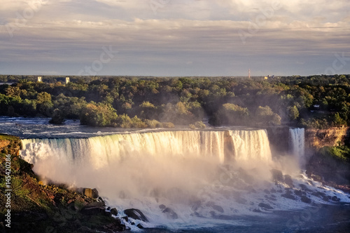 Niagara Falls is the collective name for three waterfalls located at the international border between Canada and the United States.