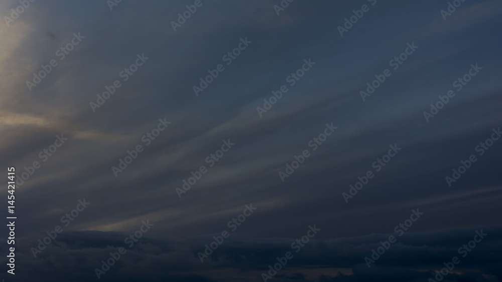 Blue sky with clouds. Wavy clouds. Dark sky. Blue sky with clouds. Wavy clouds. Dark sky.