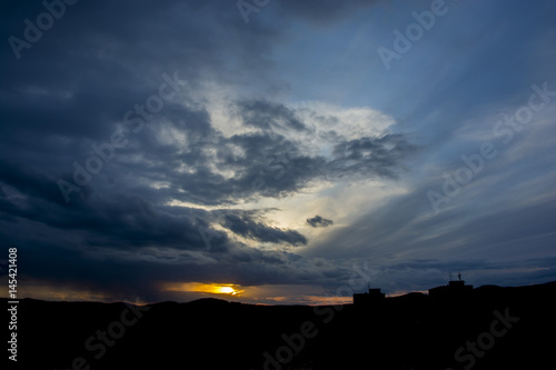 Sunset with partly cloudy sky. Dramatic sky