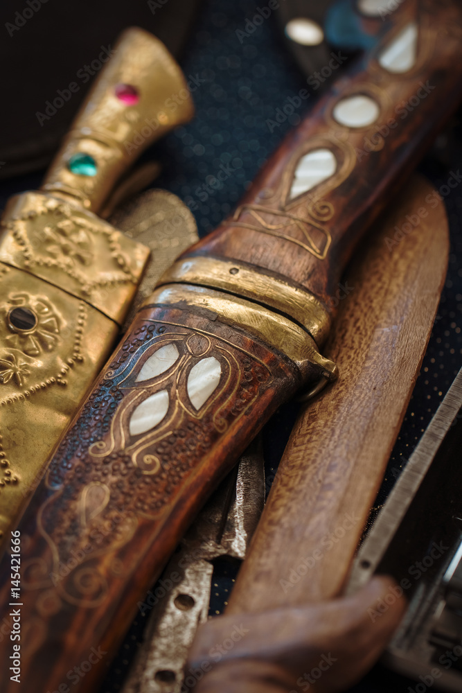macro antique daggers on counter in bazaar macro antique daggers on counter in bazaar
