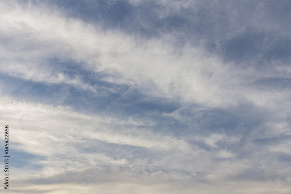 soft white clouds against blue sky background.
