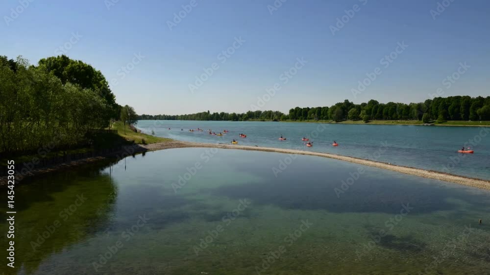 Water activities at the lake in spring on a windy and sunny day Water activities at the lake in spring on a windy and sunny day