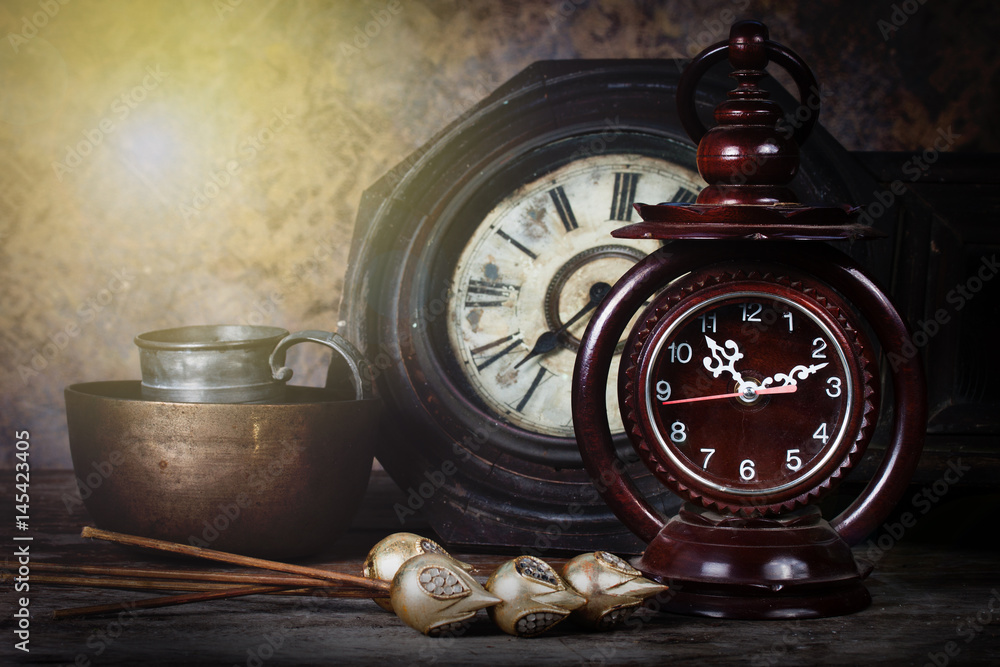 Group of objects on wood table. old clock, antique wooden clock ,Still life Group of objects on wood table. old clock, antique wooden clock ,Still life