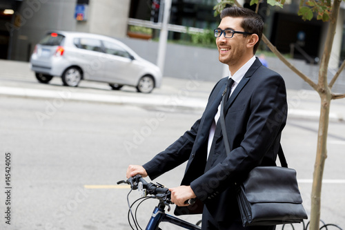 Young businessmen with a bike © Sergey Nivens