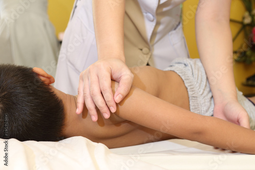 Asian kid getting a massage