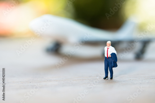 Miniature people with plane , business travel concept