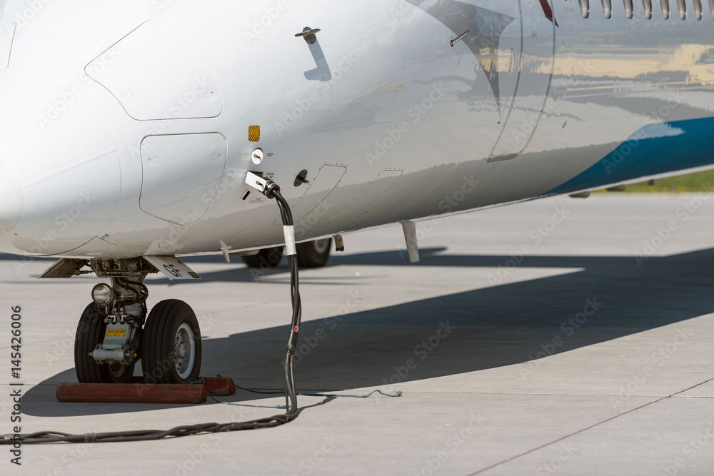 Refuelling operation of a jet - landscape Refuelling operation of a jet - landscape