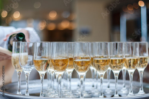 A pyramid of glasses with champagne